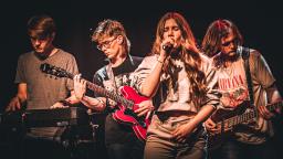 a group of young people play in a band