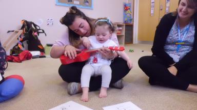 parent and baby playing a child