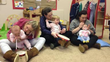 parents and babies making music together