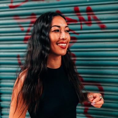 jess iszatt smiles and wears a black top